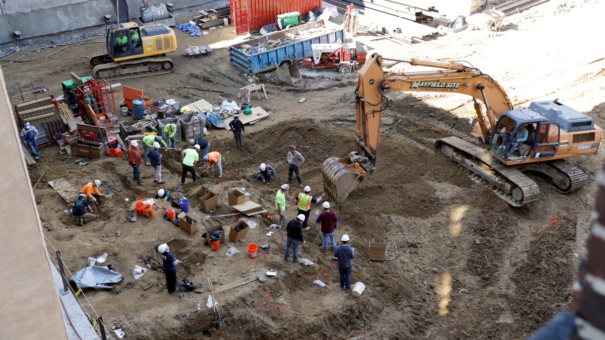 Workers excavate coffins from a construction site in the Old City neighborhood March 9 in Philadelphia.   (Matt Slocum/AP Photo) 