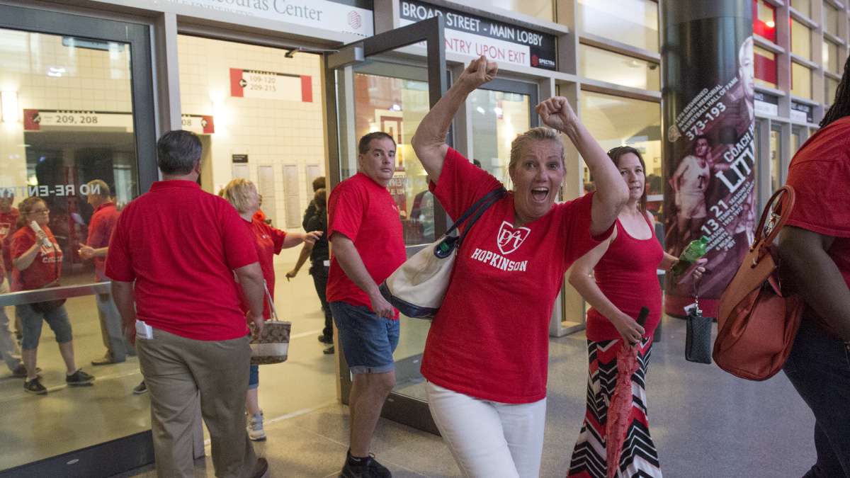 An ecstatic PFT member leaves the Liacouras Center at the conclusion of the vote.