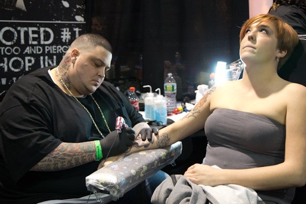 Lindsay Hines from Belmar N.J. is getting a tattoo. (Kimberly Paynter/WHYY)