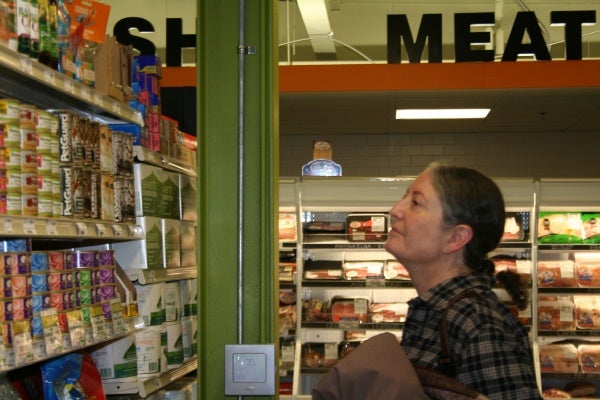 <p><p>Elkins Park resident and CreekSide member Laura Frank peruses the shelves on the brand new cooperative's opening day. Weavers Way Co-op, in Mount Airy, helped get CreekSide off the ground. (Lane Blackmer/for NewsWorks)</p></p>
