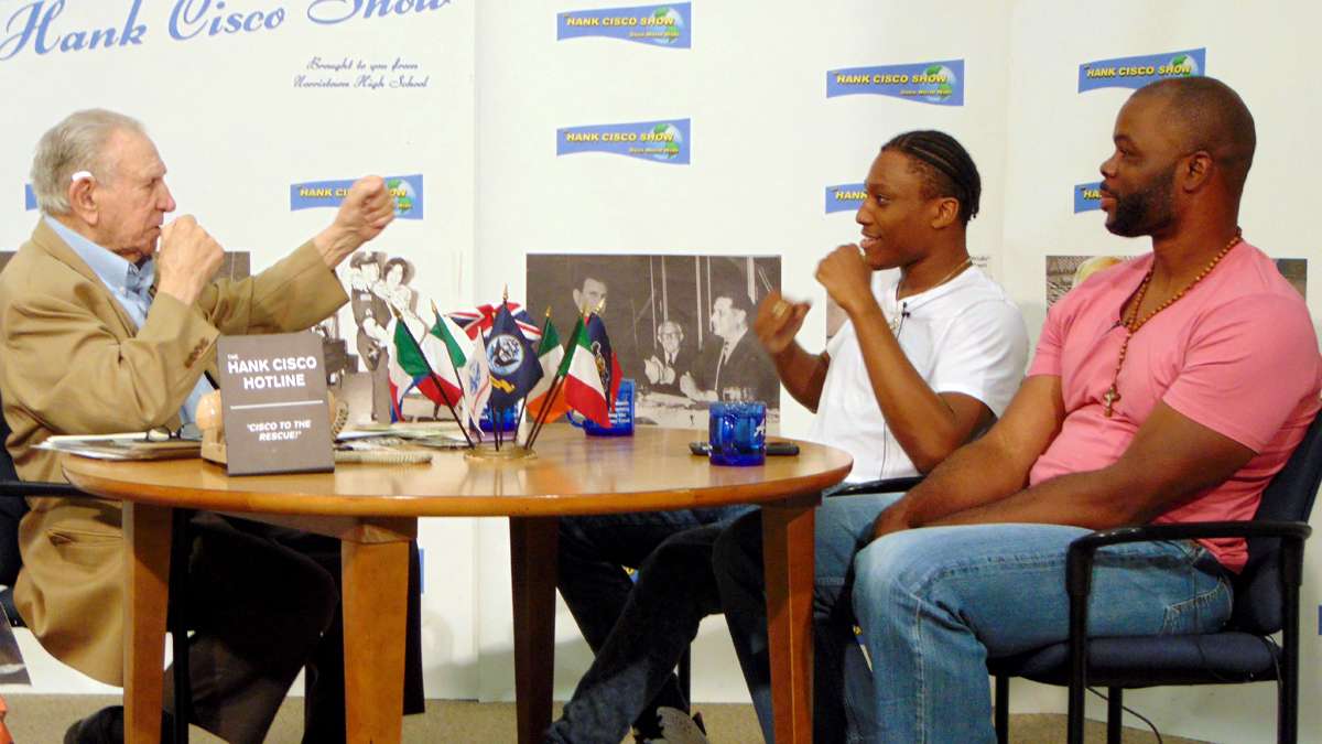 Hank Cisco, the ambassador of Norristown, interviews boxers Hakim Tito Lopez and Michael Grant on his public-access show, which Norristown High School students produce.