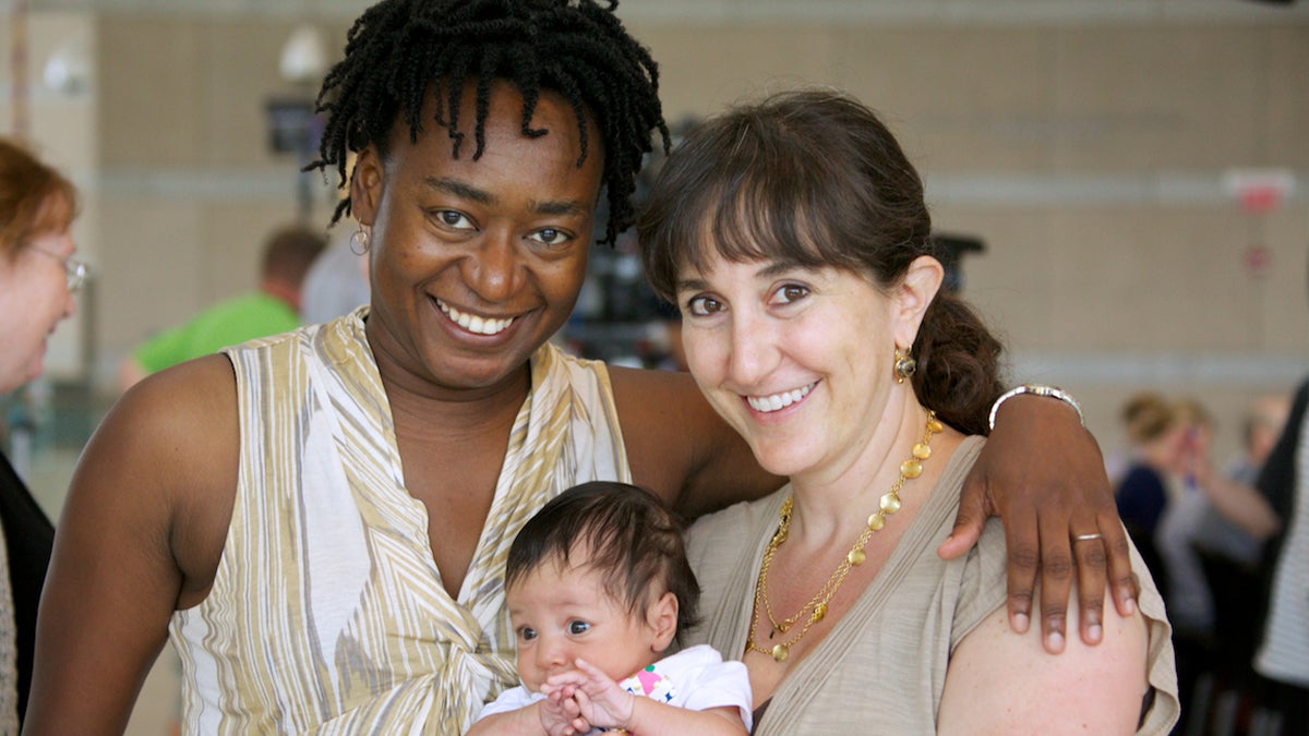  Dara Raspberry, right, with partner, Helena Miller, and their daughter, Zivah. (Nat Hamilton/for NewsWorks) 