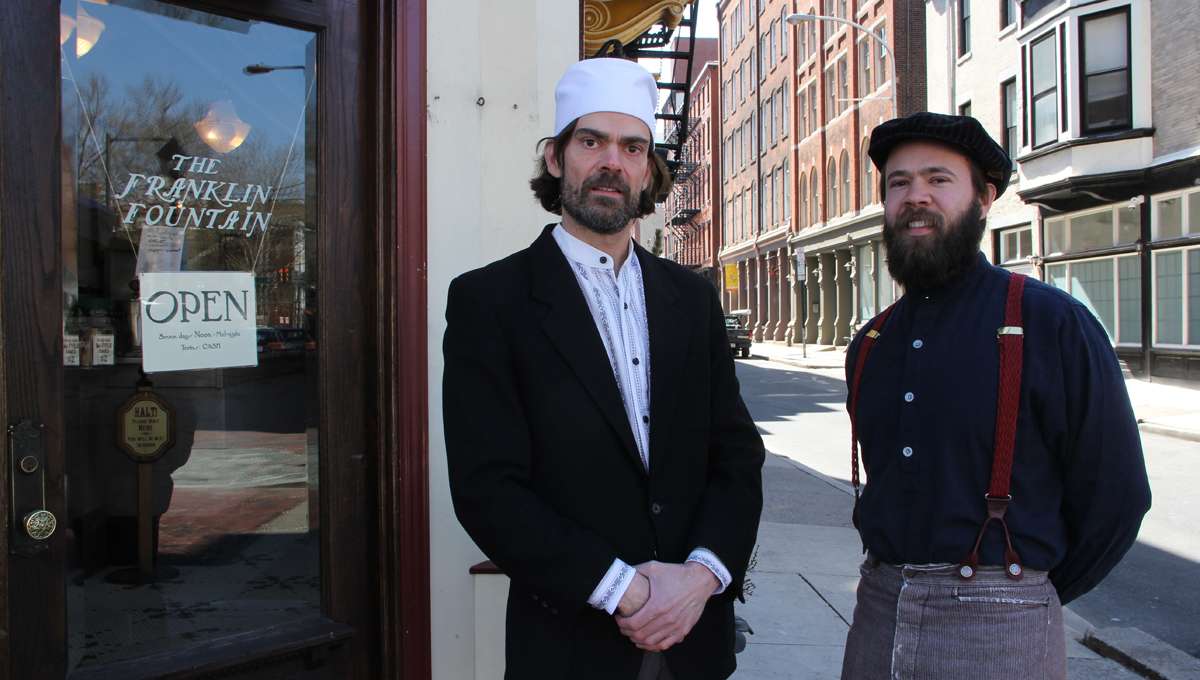 Ryan Berley (left), with his brother Eric, owns the Franklin Fountain in Old City, where crime is down.