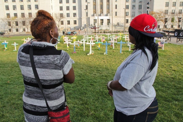 <p>Lifetime Camden residents Angel Moore and Tazamakia Johnson are especially saddened by the amount of women represented in the memorial. (Kimberly Paynter/for NewsWorks)</p>
