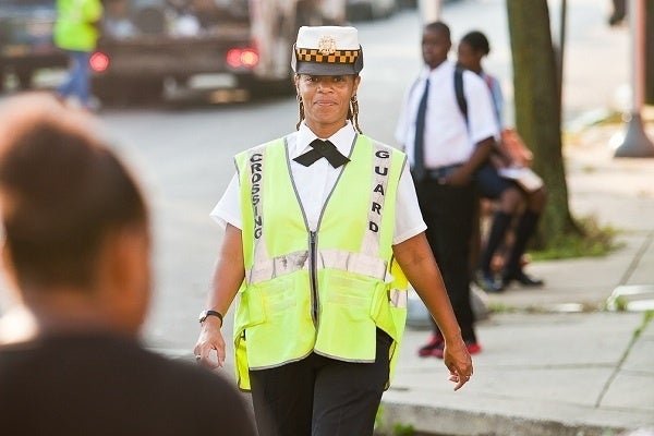 <p><p>Crossing guard Wanda Taylor watched over the intersection of Sprague St. and E. Chelten Ave. on the first day of school at Pastorius Elementary. (Brad Larrison/for NewsWorks)</p></p>
