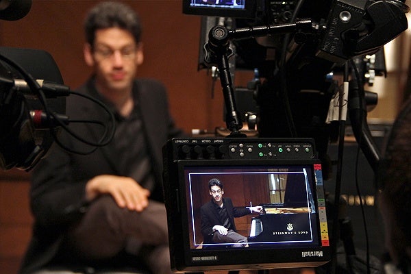 Pianist Jonathan Biss delivers his lecture from a piano bench and plays to illustrate his points. (Emma Lee/for NewsWorks)
