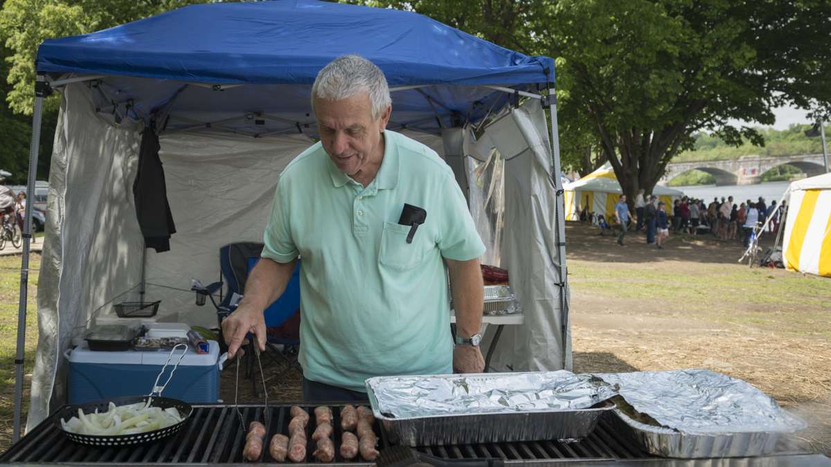 Ed Hojnacki grills food that he plans to share with his granddaughter’s team from Fordham University. Hojnacki drove from South Carolina to support his family at the Dad Vail Regatta.