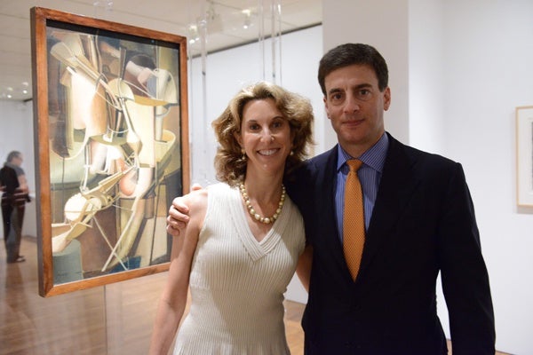 <p><p>Jaimie Field, Philadelphia Museum of Art trustee (left), and her husband David, stand in front of Marcel Duchamp's 1912 painting, "Bride." (Photo courtesy of Kelly & Massa Photography)</p></p>
