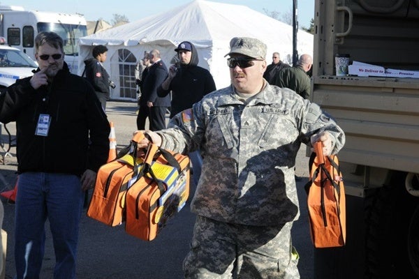 <p><p>Sgt Mark Mitchell unloads supplies at Midland Beach disaster relief distribution point. (US Army photo by Sergeant 1st Class William Gates, courtesy 101st Public Affairs Detachment)</p></p>
