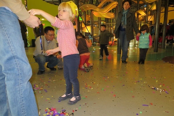 <p><p>Revelers collect confetti from New Year's Eve celebrations at the Delaware Children's Museum (Shirley Min/WHYY)</p></p>
