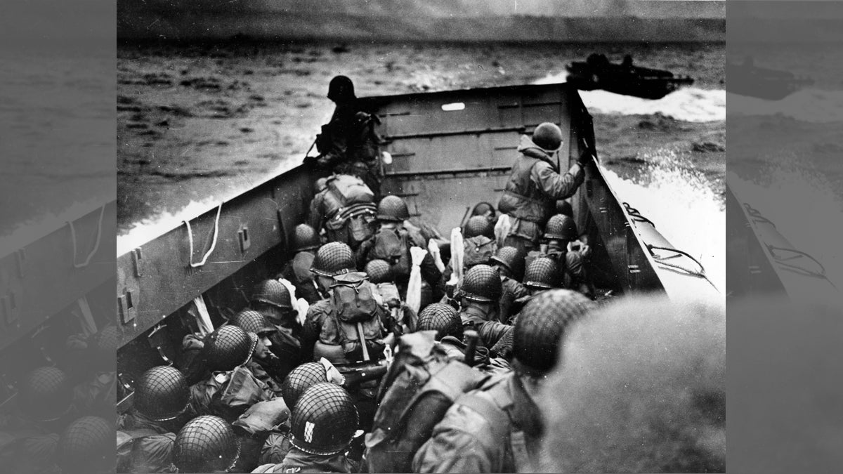  In this photo provided by the U.S. Coast Guard, a U.S. Coast Guard landing barge, tightly packed with helmeted soldiers, approaches the shore at Normandy, France, during initial Allied landing operations, June 6, 1944. These barges ride back and forth across the English Channel, bringing wave after wave of reinforcement troops to the Allied beachheads. (AP Photo) 