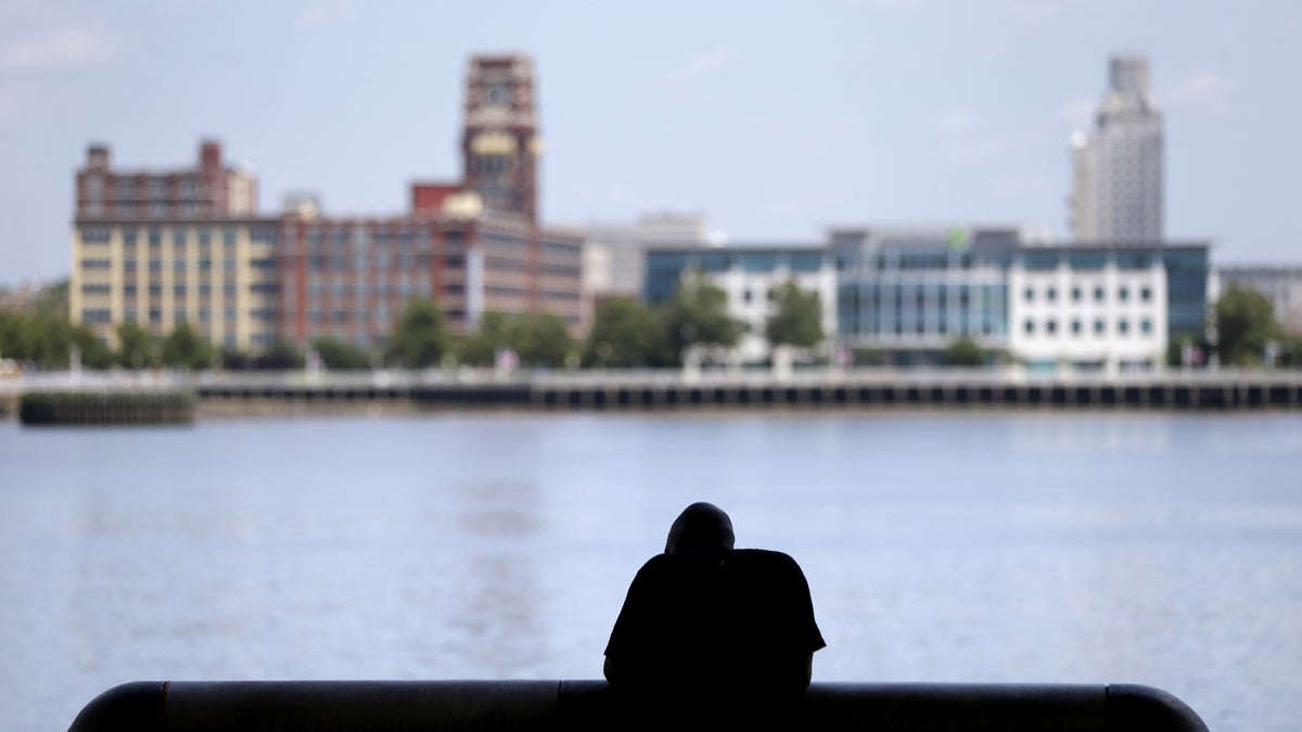  A man rests in the shade along the Delaware River in Philadelphia. (AP Photo/Matt Rourke, file) 
