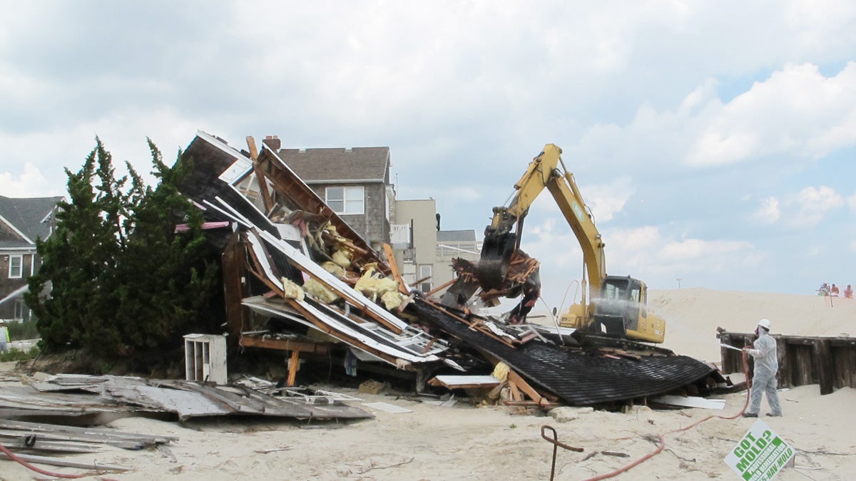  Workers tear down Rich Hennion's home in Normandy Beach that was damaged beyond repair by Superstorm Sandy (Phil Gregory for NewsWorks). 