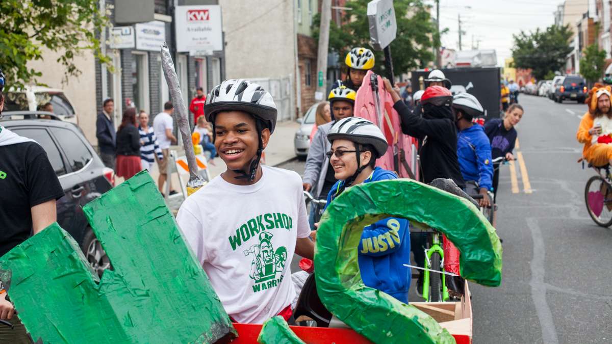 Students from the Workshop School in West Philadelphia wait to restart the ride through Fishtown