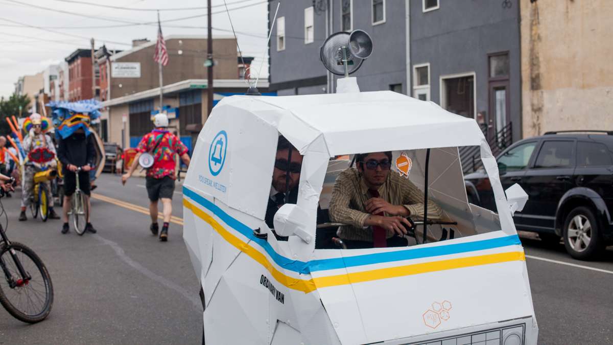 The H4ck3rs team steer their surveilance-themed float through Fishtown