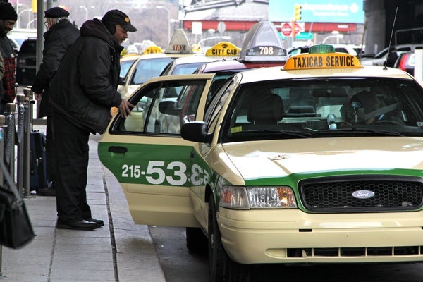 <p>Cabs wait in line for passengers at 30th Street Station. (Emma Lee/for NewsWorks)</p>

