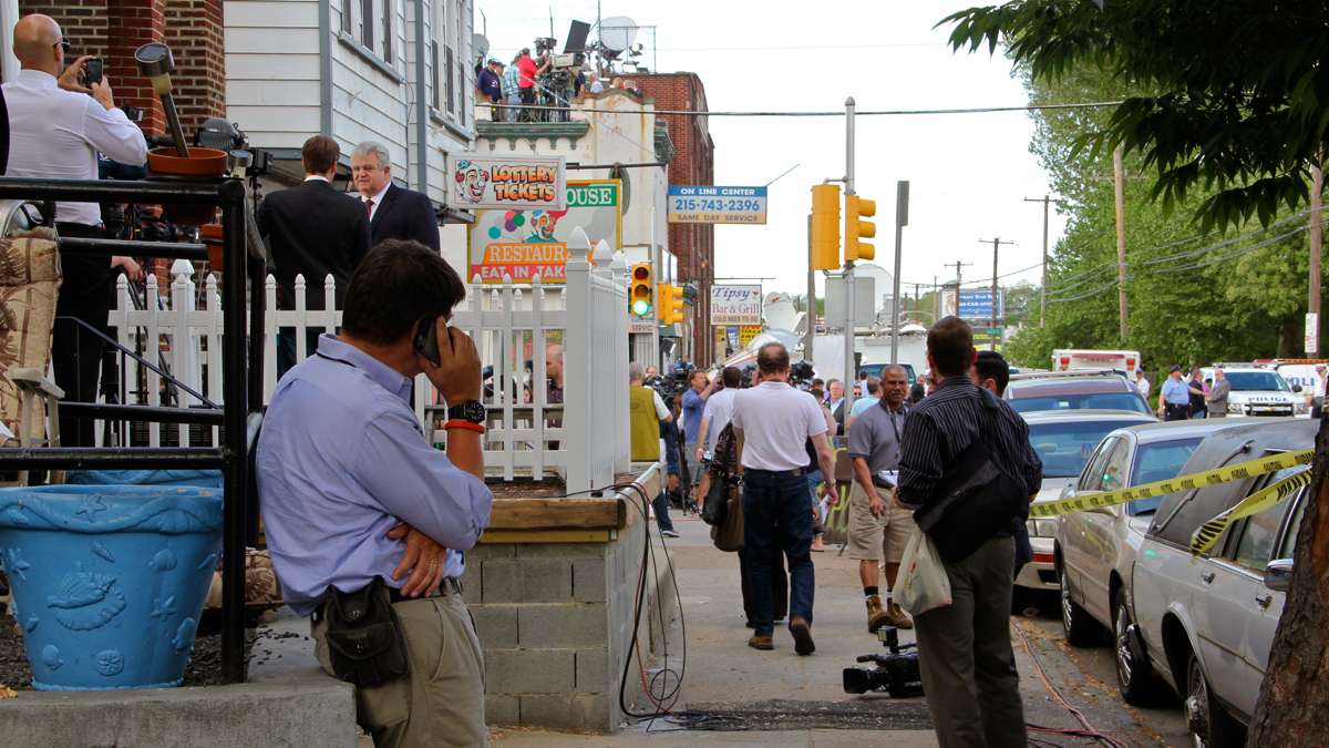 Media swarm over the roofs, yards, streets and sidewalks of the North Philadelphia neighborhood nearest the site of the deadly train derailment.