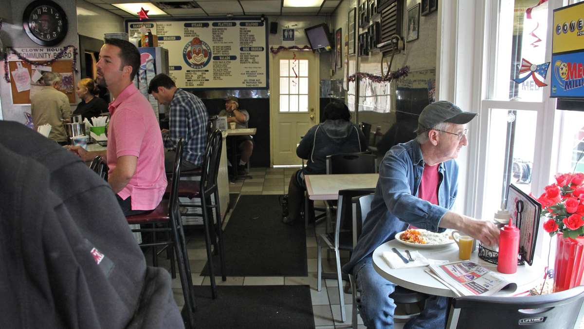Patrons at the Clown House diner can watch the comings and goings of journalists, emergency responders and investigators while enjoying their creamed chipped beef and coffee.