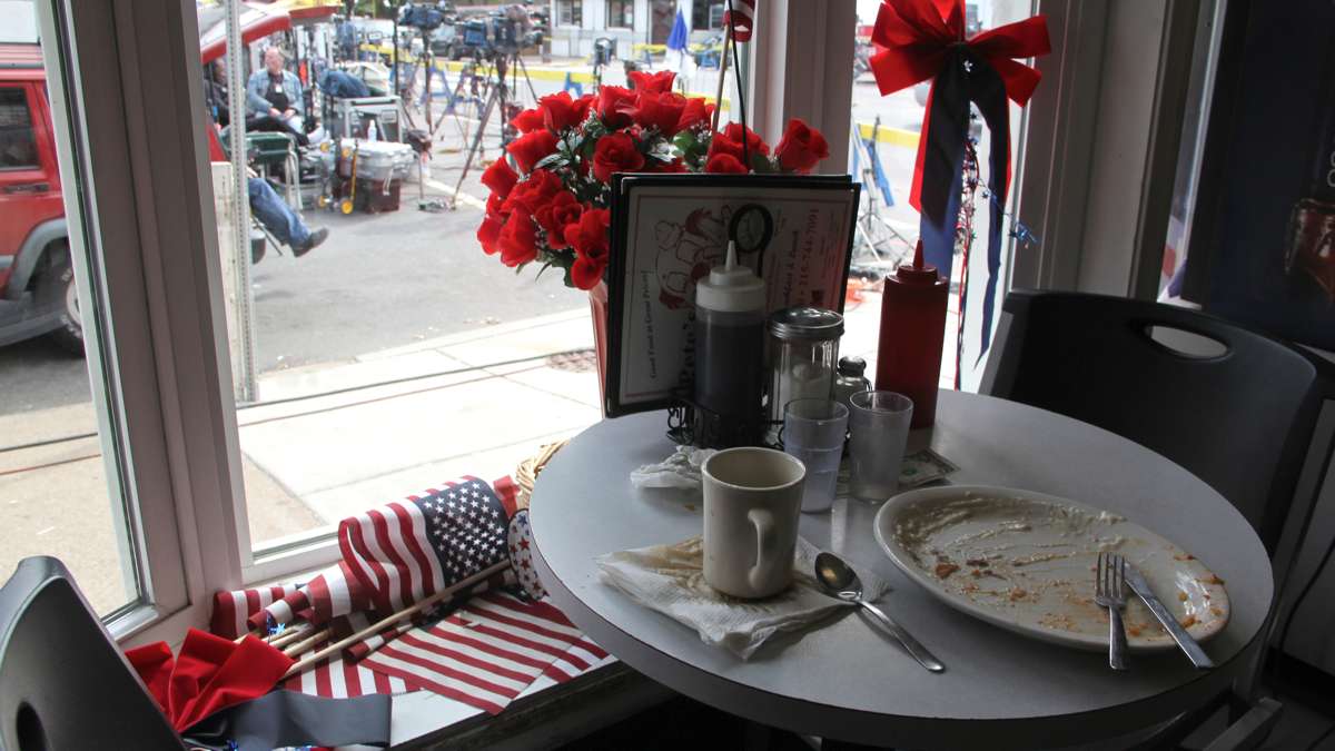 Patrons at the Clown House diner can watch the comings and goings of journalists, emergency responders and investigators while enjoying their creamed chipped beef and coffee.