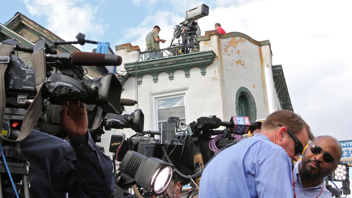 Jon Powell allowed camera crews and photographers to take up positions on his roof, which overlooks the site of the train wreck.