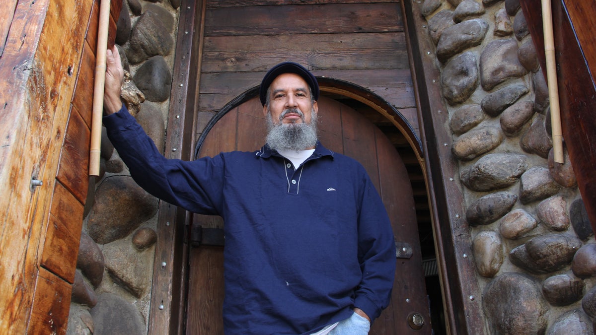  Dino Vazquez's home, as well as his art, is constructed with salvaged materials. He collected the wood, stone and ornaments used to create a grand entrance to his home/studio on North Fifth Street. (Emma Lee/for NewsWorks) 