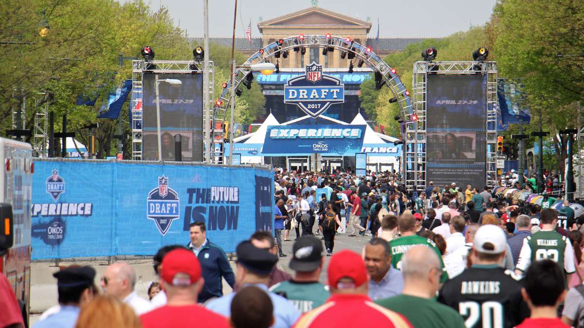  Crowds at the NFL Draft Experience stroll the Benjamin Franklin Parkway on the first day of the NFL Draft in Philadelphia, Pa. (Emma Lee/WHYY) 