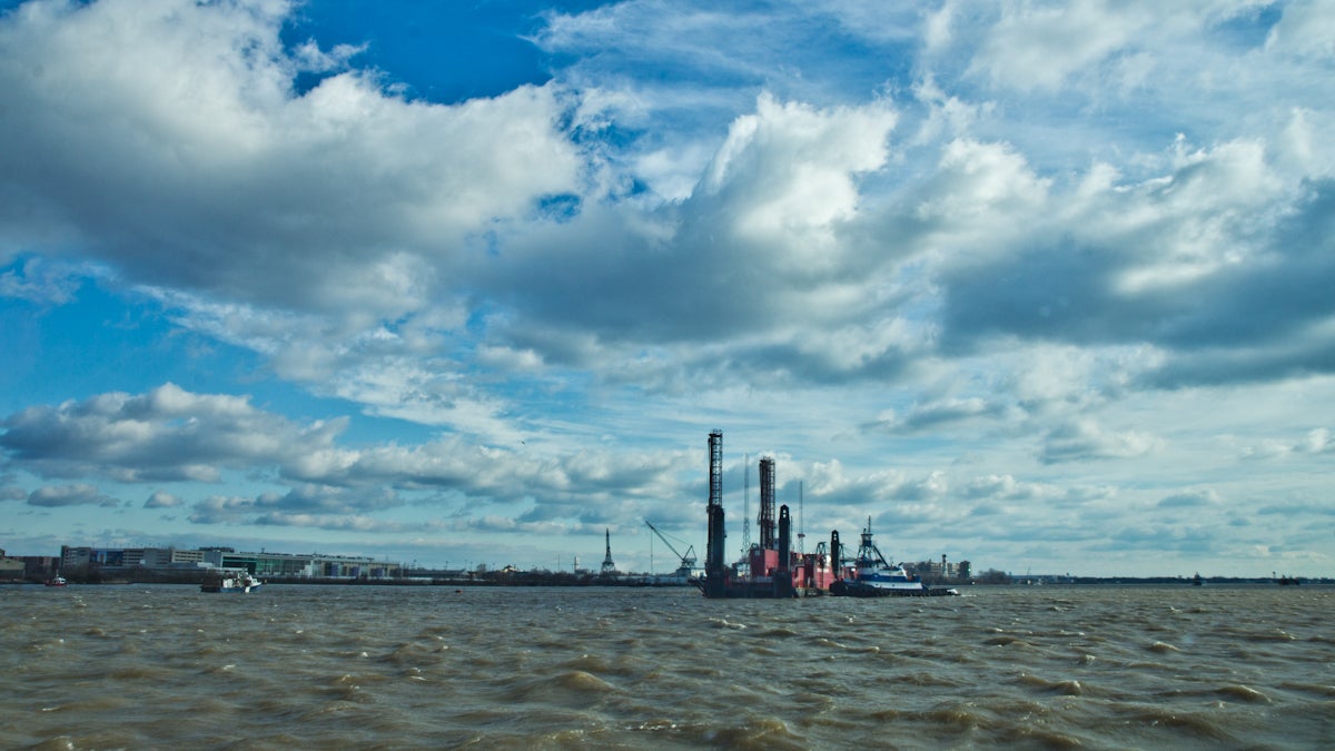 The Drillboat Apache works to deepen the Delaware River near Chester Pa., in March of 2016. (Kimberly Paynter/WHYY)