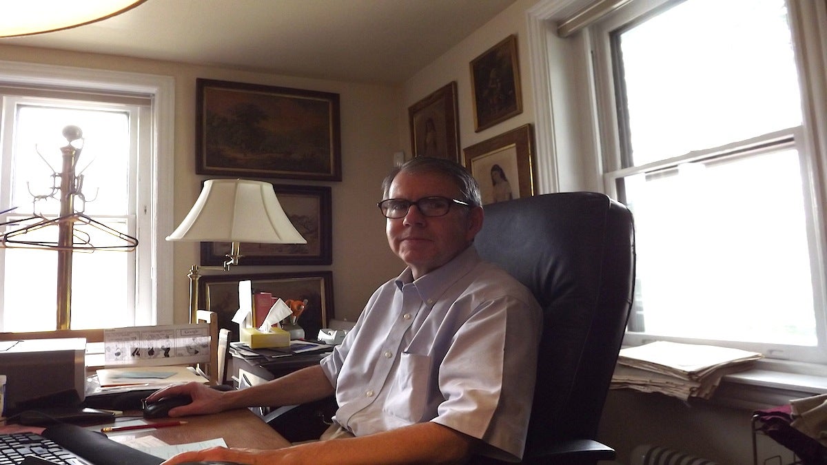  David Moore in his office at the Philadelphia Print Shop. (Neema Roshania/WHYY) 