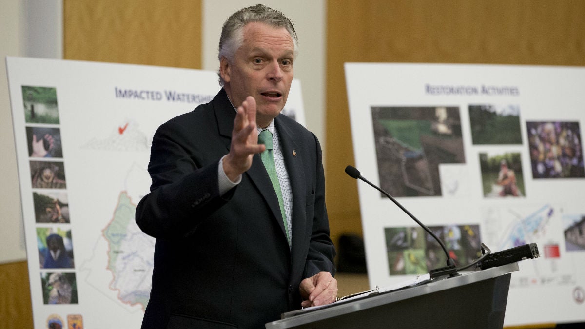  Virginia Gov. Terry McAuliffe gestures during a news conference at the Capitol in Richmond, Va. In December, McAuliffe announced a proposed $50 million settlement to resolve claims stemming from the release of mercury from the former DuPont facility in Waynesboro, Virginia. (AP Photo/Steve Helber) 