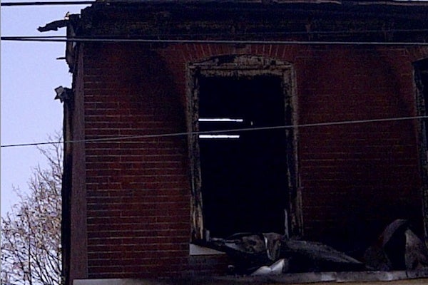 <p><p>Fire damaged the building's roof such that it was possible to see through it. (Brian Hickey/WHYY)</p></p>

