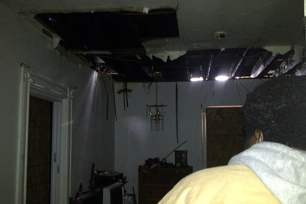 <p><p>Folk shows NewsWorks some of the damage in the home from which he, his wife, his five children and two dogs escaped Sunday night. (Brian Hickey/WHYY)</p></p>

