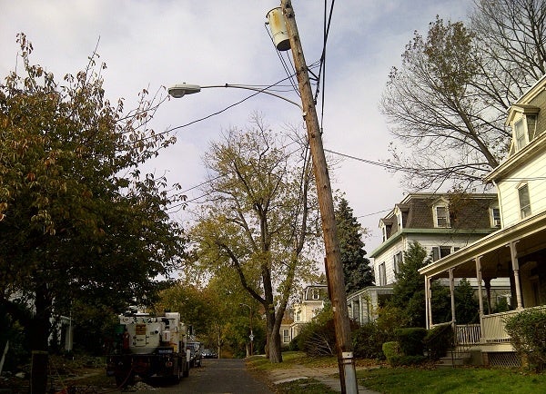 <p><p>A lightpost on Independence Street in East Oak Lane took a beating in the storm. (Brian Hickey/WHYY)</p></p>
