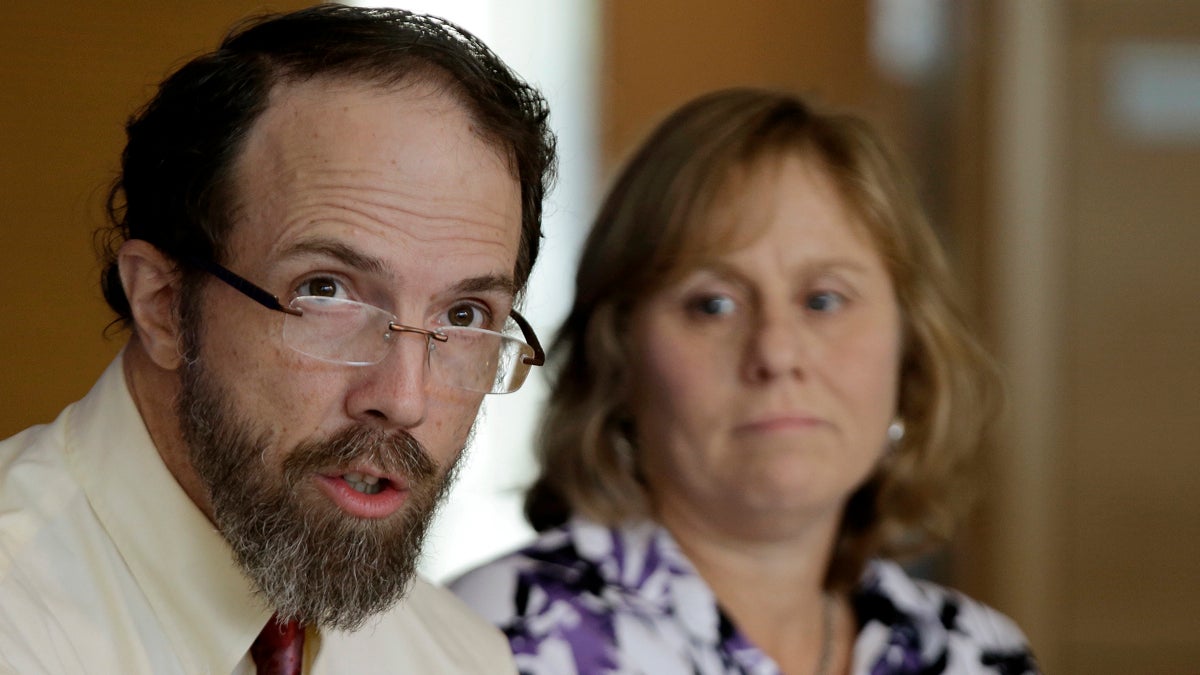 ebola-massachusetts-doctor Dr. Rick Sacra, an American doctor who contracted the Ebola virus in Africa and his wife, Debbie Sacra, address reporters during a media availability at the University of Massachusetts Medical Schoolin September. (AP Photo/Stephan Savoia)