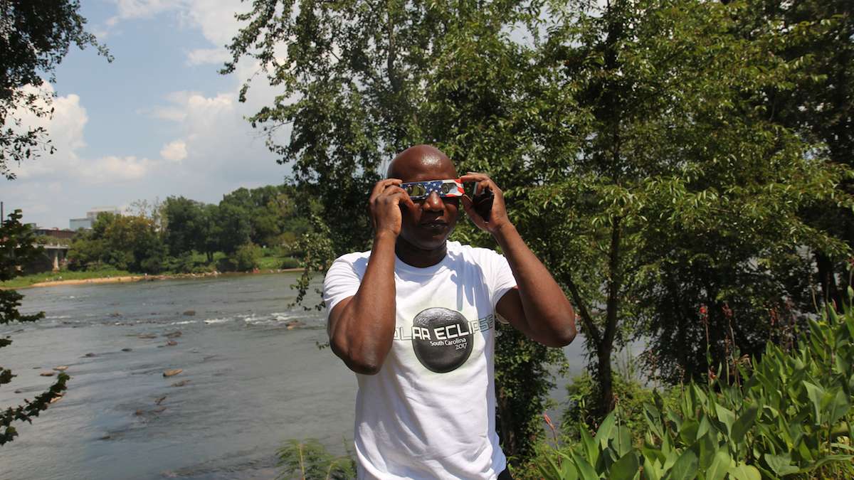 Vincent Ayukl traveled from New York to view the solar eclipse in Columiba, South Carolina. (Kimberly Paynter/WHYY)