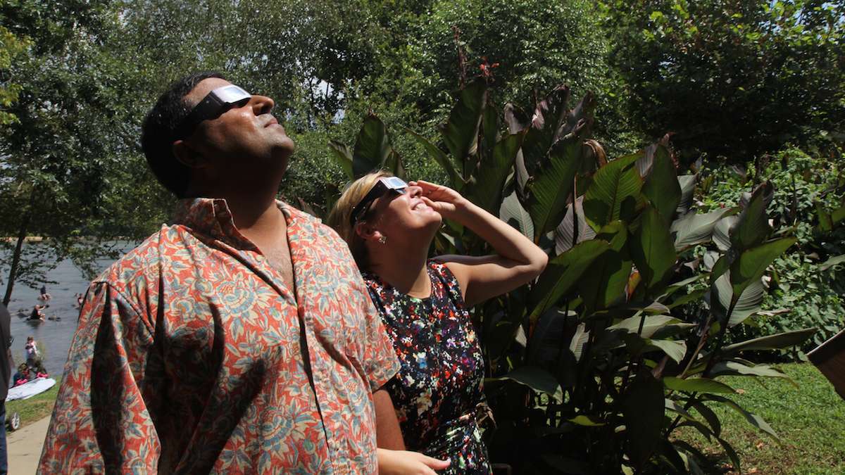 Jordan and Deb Desai view the 2017 solar eclipse in Columbia, South Carolina. (Kimberly Paynter/WHYY)
