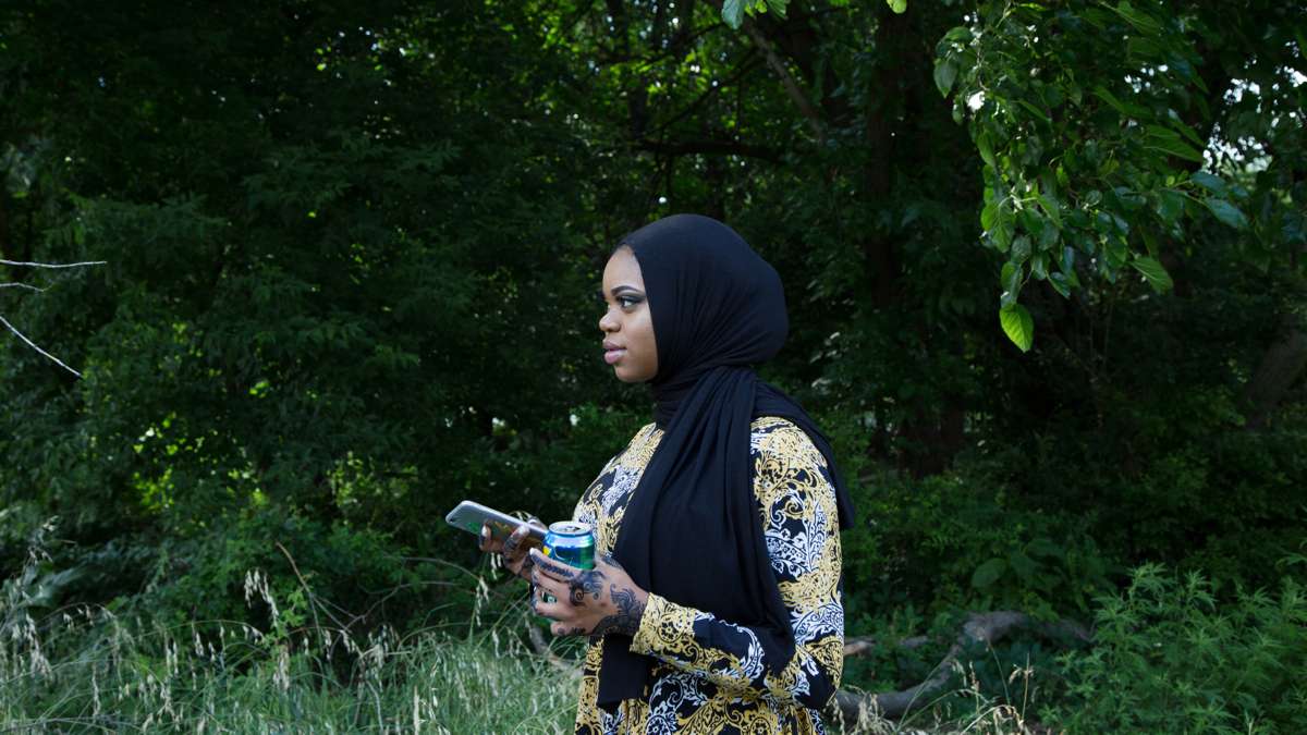 Sumayyah speaks to her brothers at Eid al-Fitr festivities in FDR Park