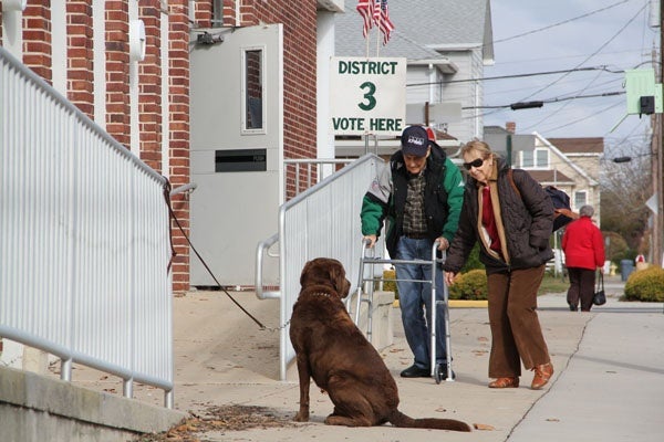 <p>Voters arrive at the Union Avenue School in Margate.  When the municipal building lost power because of Hurricane Sandy, an alternate polling place was arranged. (Emma Lee/for NewsWorks)</p>
