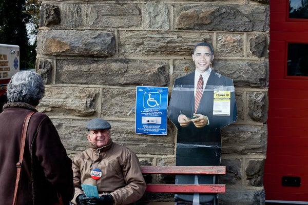 <p><p><span style="font-size: 12pt; line-height: 115%; font-family: 'Helvetica','sans-serif';">A cardboard cutout of President Obama kept watch outside of Fire Engine #37 in Chestnut Hill Tuesday. (Brad Larrison/ for NewsWorks)</span></p></p>
