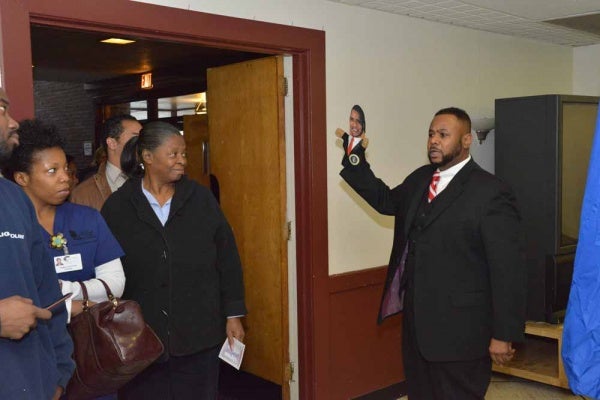 <p><p>Councilman Curtis Jones, Jr. chants "fired up and ready to go" to voters while holding an Obama hand puppet at Pinn Memorial Baptist Church. (Bas Slabbers/for NewsWorks)</p></p>
