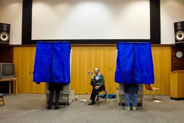 <p><p><span style="font-size: 12pt; line-height: 115%; font-family: 'Helvetica','sans-serif';">Brian Rudnick keeps watch over the polls at the Chestnut Hill library Tuesday afternoon. (Brad Larrison/ for NewsWorks)</span></p></p>
