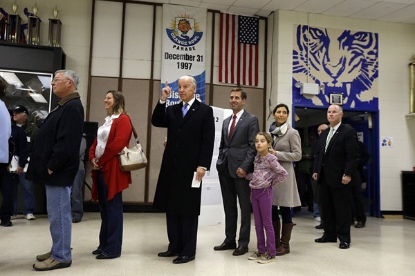 <p>Vice President Joe Biden, accompanied by his son Beau Biden, his wife, Hallie and their daughter Natalie, stands in line to cast his ballot at Alexis I. duPont High School, Tuesday, Nov. 6, 2012, in Greenville, Del. (AP Photo/Matt Rourke)</p>
