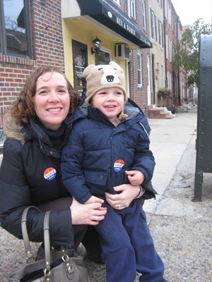<p>Sarah Graden took along son Owen, 3, to vote at the VA meeting hall in Fairmount. (Maiken Scott/WHYY)</p>
