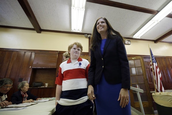 <p>Kathleen Kane, democratic candidate for Pennsylvania Attorney General, right, walks with her son Chris Kane, 11, as she prepares to vote at a polling place in the Waverly Community House, Tuesday, Nov. 6, 2012, in Waverly, Pa. (AP Photo/Matt Slocum)</p>
