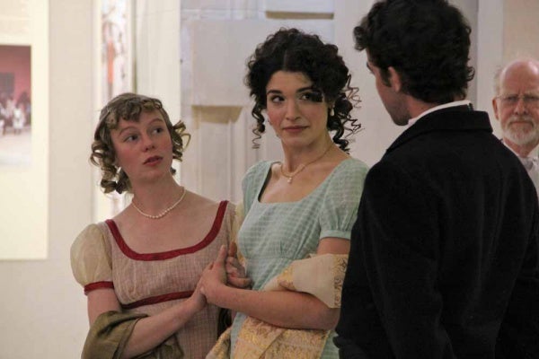 <p><p>Jane (Laura Seeley) and Elizabeth (Julia Wise) react to the unwanted attention of Mr. Collins (Brian Weiser) during a pop-up performace at the Free Public Library. (Emma Lee/for NewsWorks)</p></p>
