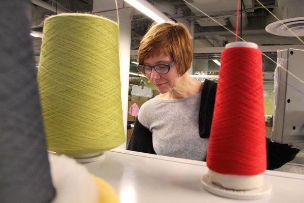 <p><p>Geneviève Dion, director of the Shima Seiki Haute Technology Lab at Drexel's ExCITe Center, programs one of four knitting machines valued at $1.2 million. (Emma Lee/for NewsWorks)</p></p>
