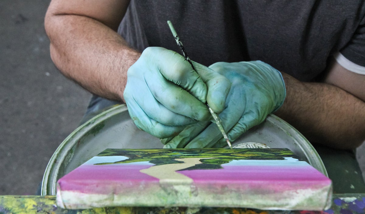 fabian_lopez1200 Fabian Lopez works on an abstract landscape painting in his Philadelphia studio. (Kimberly Paynter/WHYY)