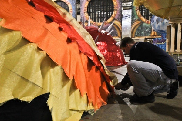 <p>Rich Francis of the Downtowners Fancy Brigade works on the planet Mercury for their 2013 theme, Birth of the Planets. (Kimberly Paynter/WHYY)</p>
