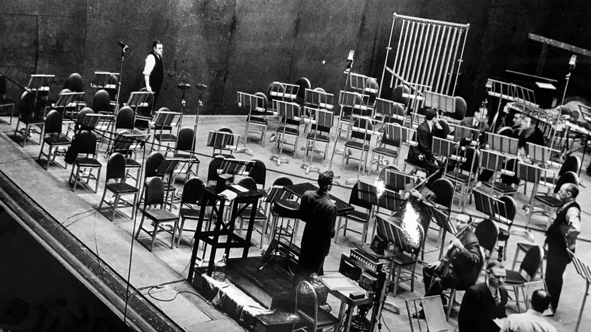  Engineers and musicians set up on stage at the Academy of music in Philadelphia in 1939, to record music for the 1940 film Fantasia. RCA's John Volkmann is pictured in the lower right, facing the camera. (Courtesy of Jesse Klapholz) 