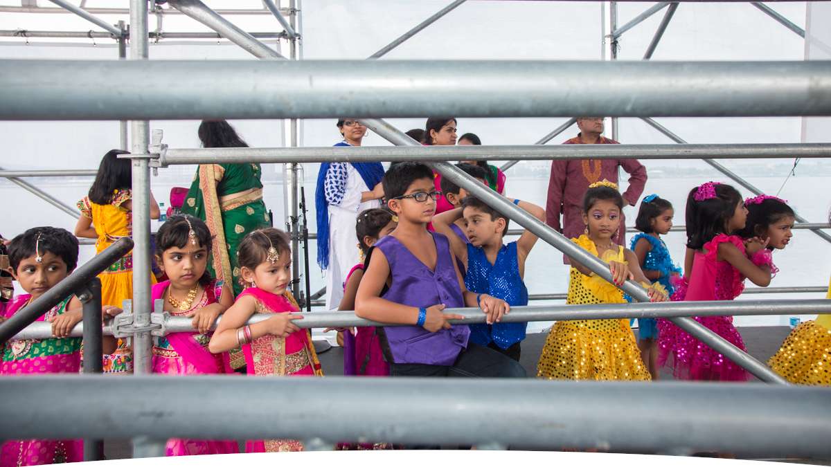 Dancers wait for their turn on stage during the Festival of India at Penn's Landing. (Emily Cohen for NewsWorks)