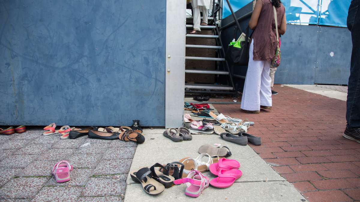 Dancers leave their shoes behind before they take the stage at the Festival of India at Penn's Landing. (Emily Cohen for NewsWorks)